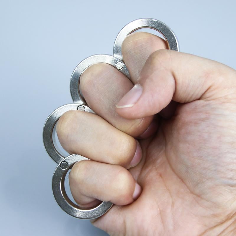 Vikbar avtryckarring för fyra fingrar
