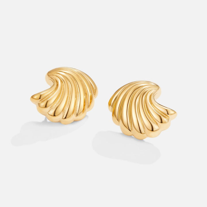 Eleganta guldörhängen med snäckdesign