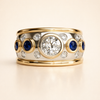 Vintage bred guldring med stenar