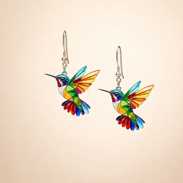 Eleganta örhängen i vitguld med färgglad kolibri