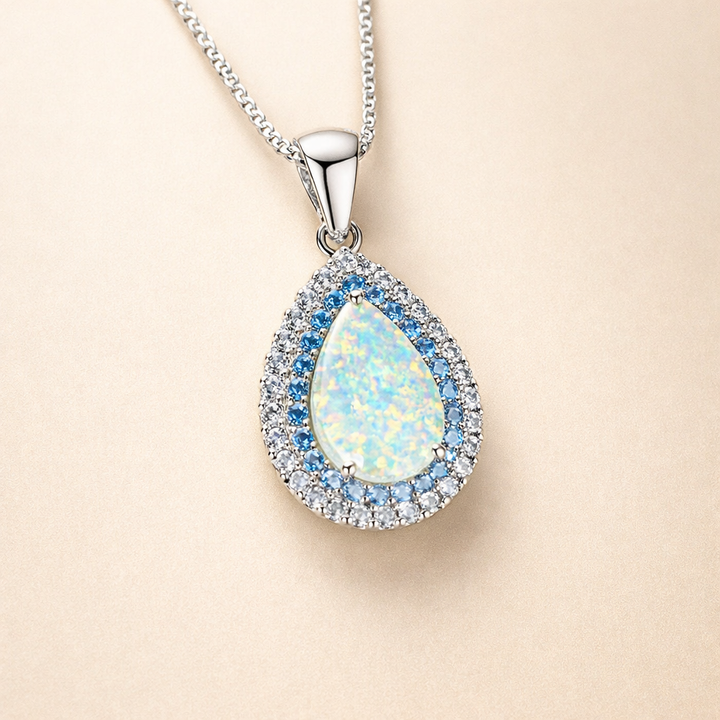 Gnistrande halsband med blå opal i vitguld