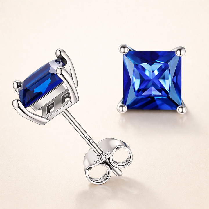 Eleganta örhängen i vitguld med safir i princesslipning