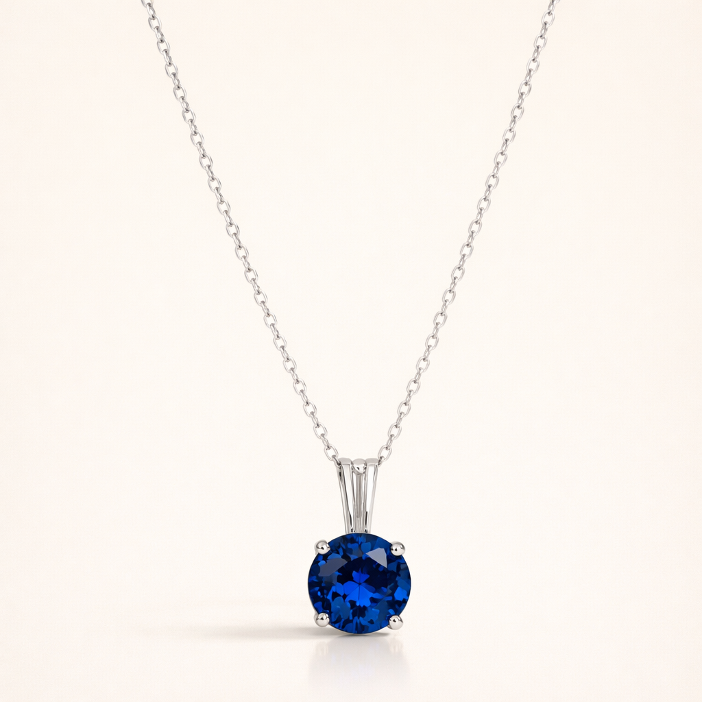 Elegant halsband i vitguld med rundslipad safir