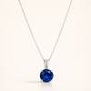 Elegant halsband i vitguld med rundslipad safir