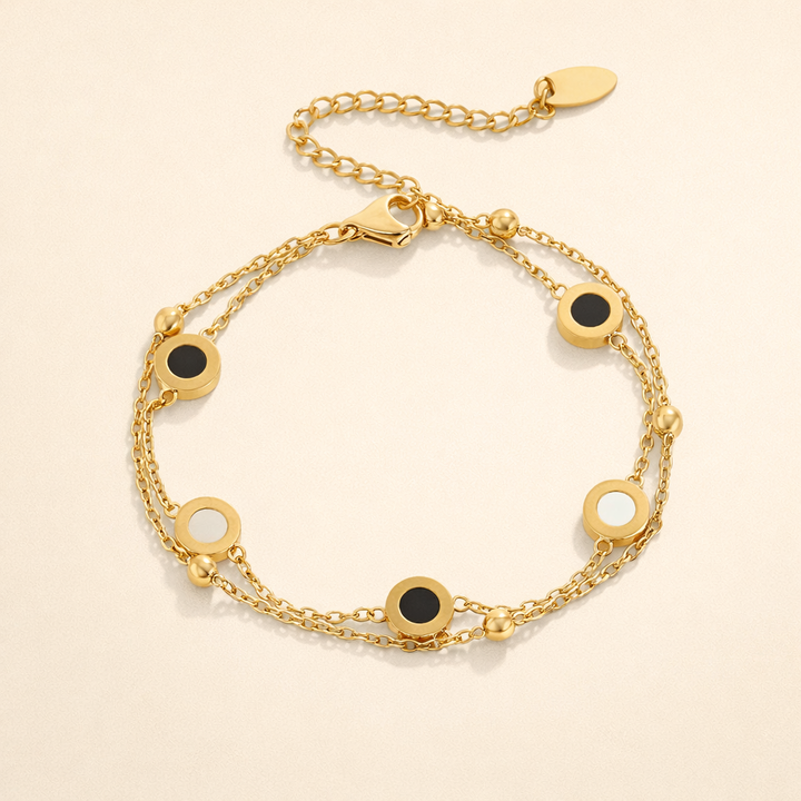 Elegant armband med onyx och vit sten