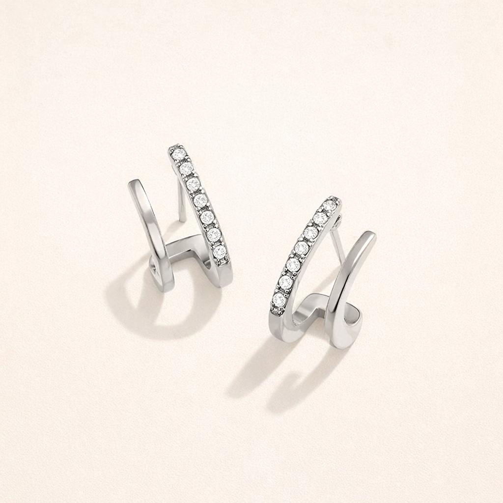 Eleganta silverörhängen med kristaller i klodesign