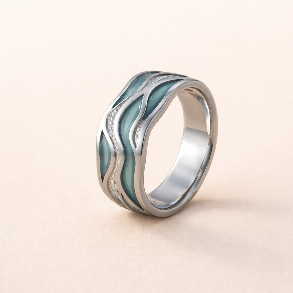 Silverring med vågig design och turkosa accenter