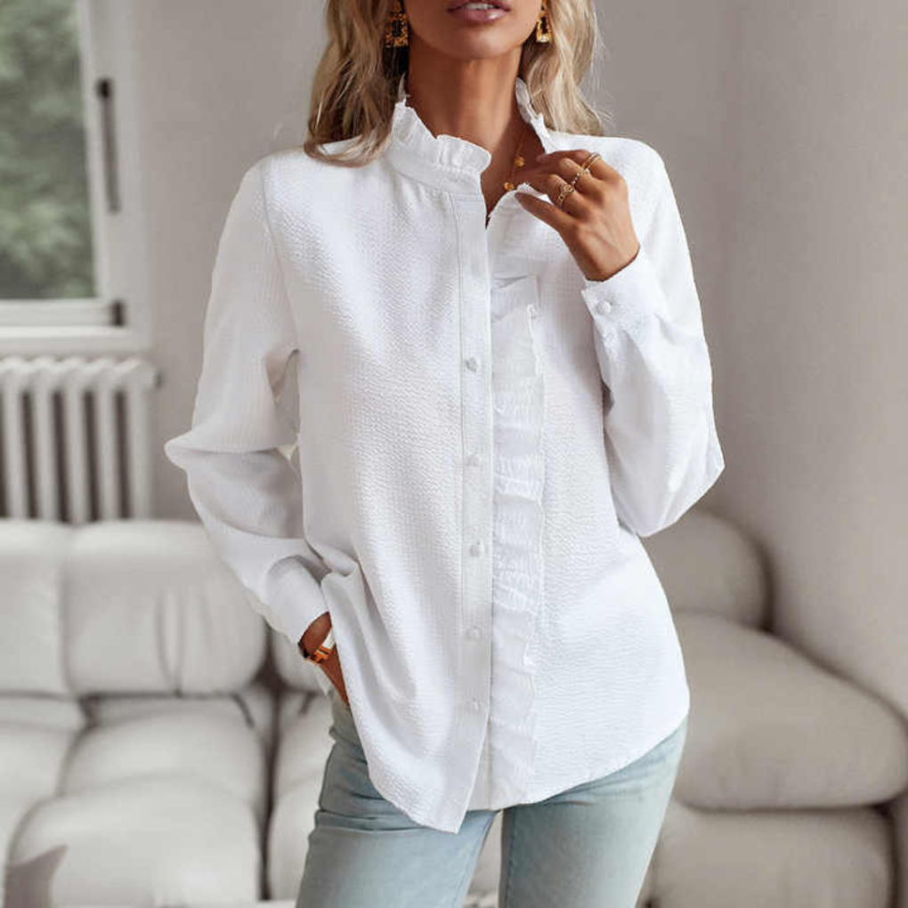 Blus med struktur och volangkant