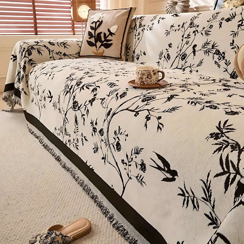 Elegant pledd med blomsterdesign og frynser