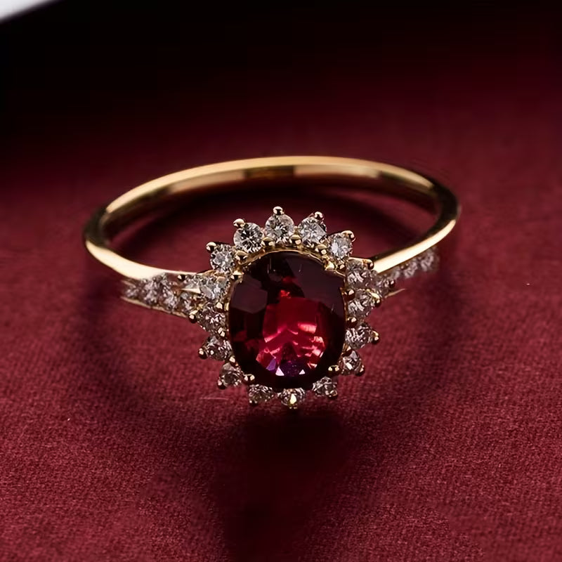 Elegant guldring med röd zirkonia