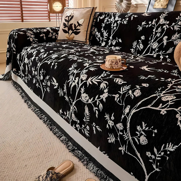 Elegant pledd med blomsterdesign og frynser