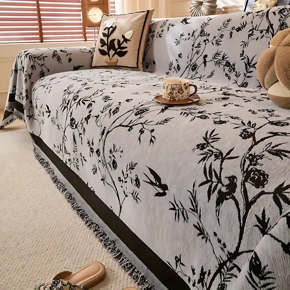 Elegant pledd med blomsterdesign og frynser