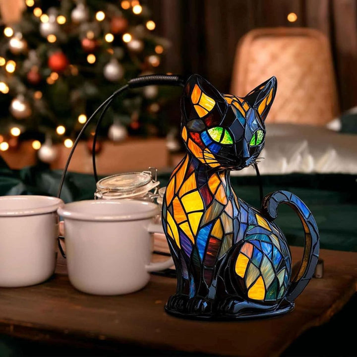 Dekorativ kattformad lampa med mosaikdesign och varmt stämningsljus – elegant heminredning