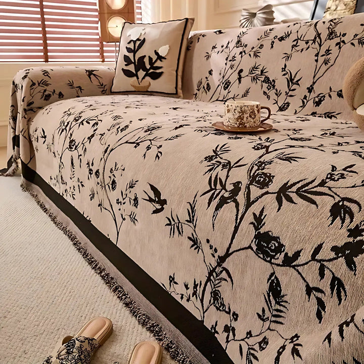 Elegant pledd med blomsterdesign og frynser