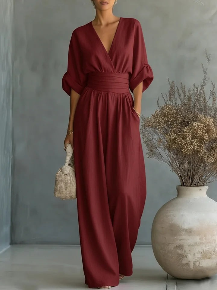 Elegant jumpsuit för dam med V-ringning och vida byxben i hög midja