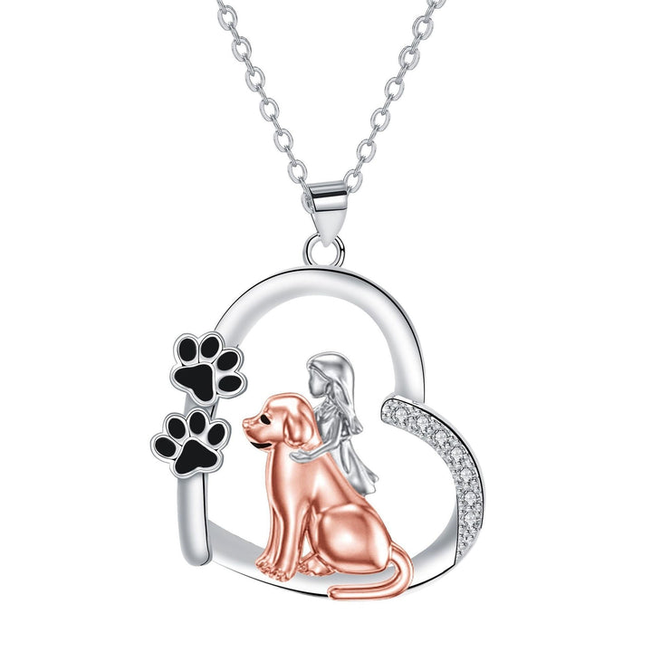 Hjärtformat halsband med hund och flicka