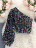 Glitrende one-shoulder topp