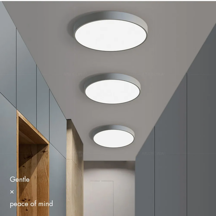 Rund LED-taklampa med ram i metall