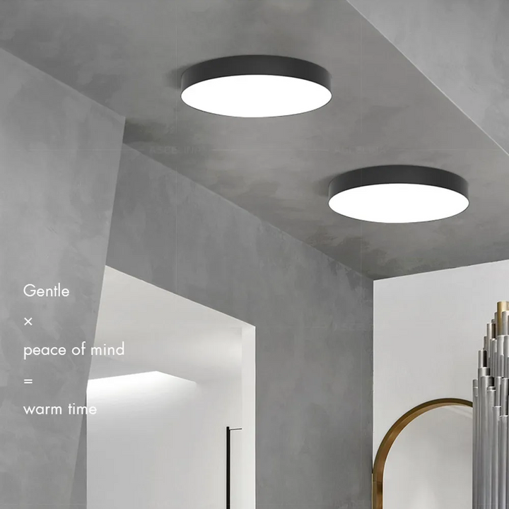 Rund LED-taklampa med ram i metall