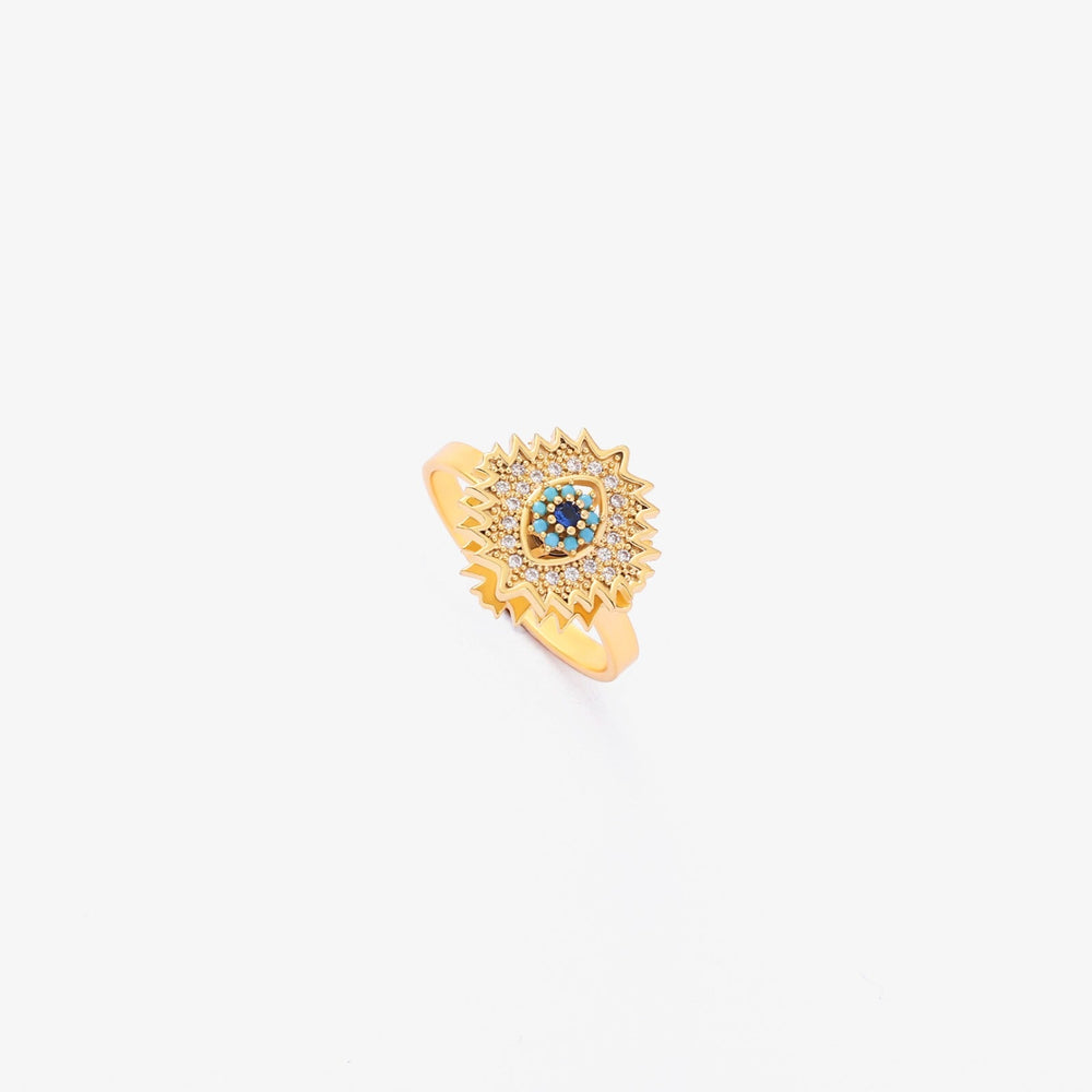 Vriden guldring med safir och solstrålsdesign