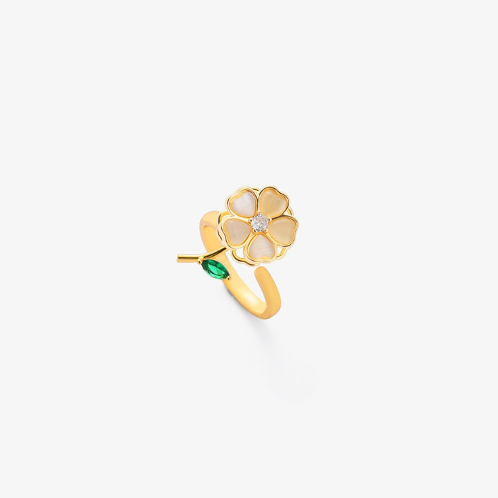 Elegant guldring med roterande blommotiv