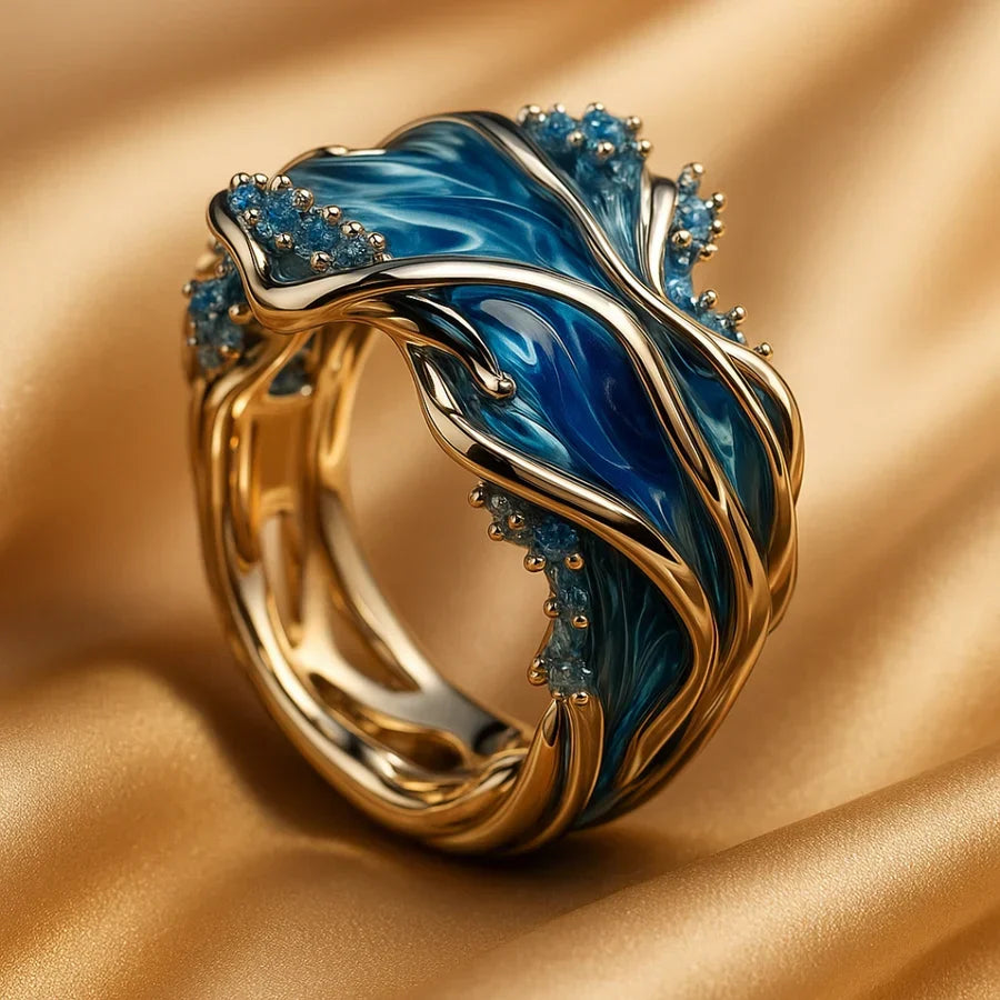 Elegant guldring med vågmotiv