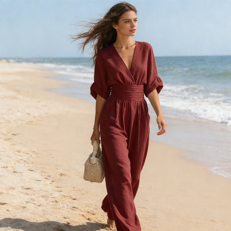 Elegant jumpsuit för dam med V-ringning och vida byxben i hög midja