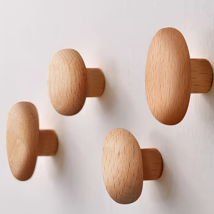 Set med runda väggkrokar i trä för väggmonterade kappor