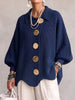 Elegant oversized-cardigan med iögonfallande knappar